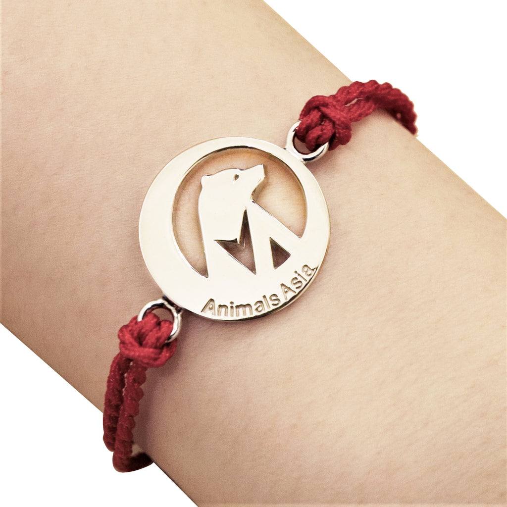Round charm with red thread bracelet